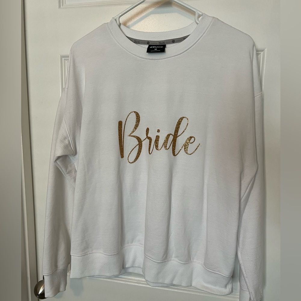 White with gold glitter lettering “Bride” sweatshirt